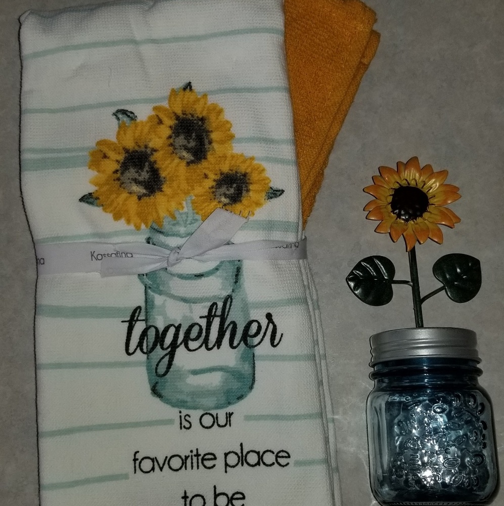 Kitchen towels and small sunflower jar